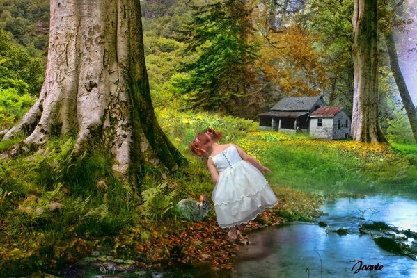 Mädchen im Wald am Fluss neben der Hütte