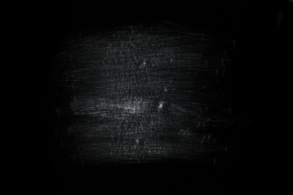Weiße Kratzer auf schwarzem Hintergrund