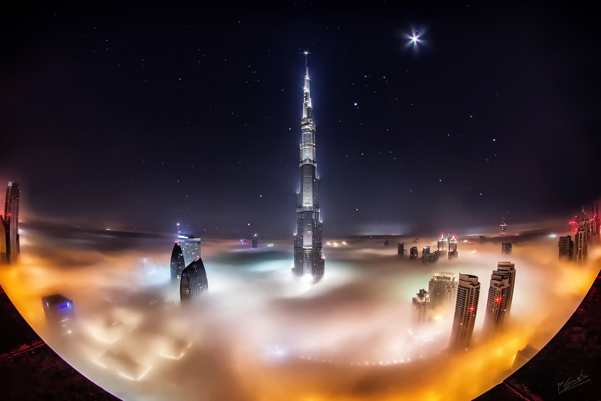 vereinigte arabische emirate stadt dubai burj khalifa tower wolken nebel nacht sterne