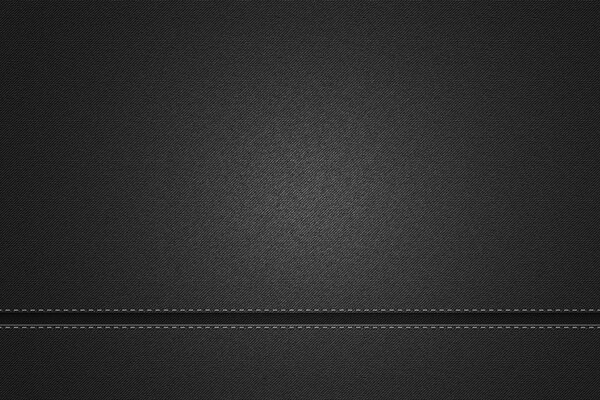 Schwarze Nähte auf grauen Jeans